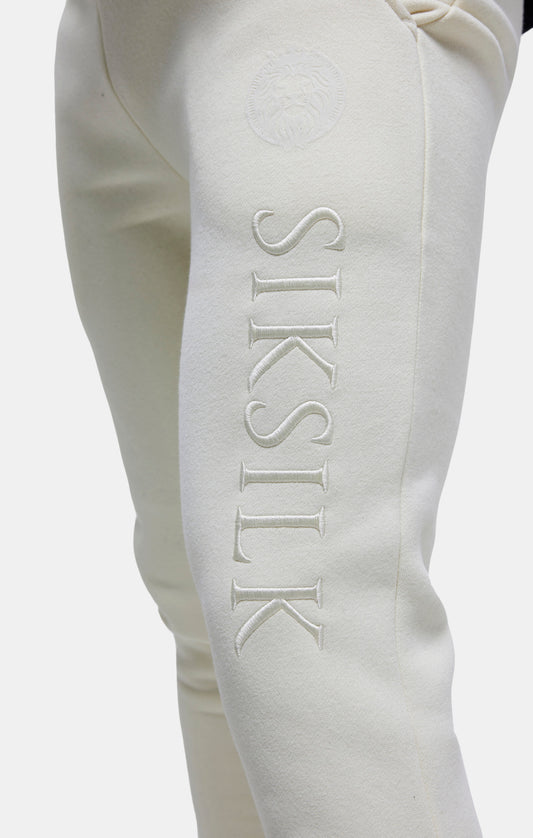 Pantalón tobillo ajustado bordado Messi X SikSilk - Crudo